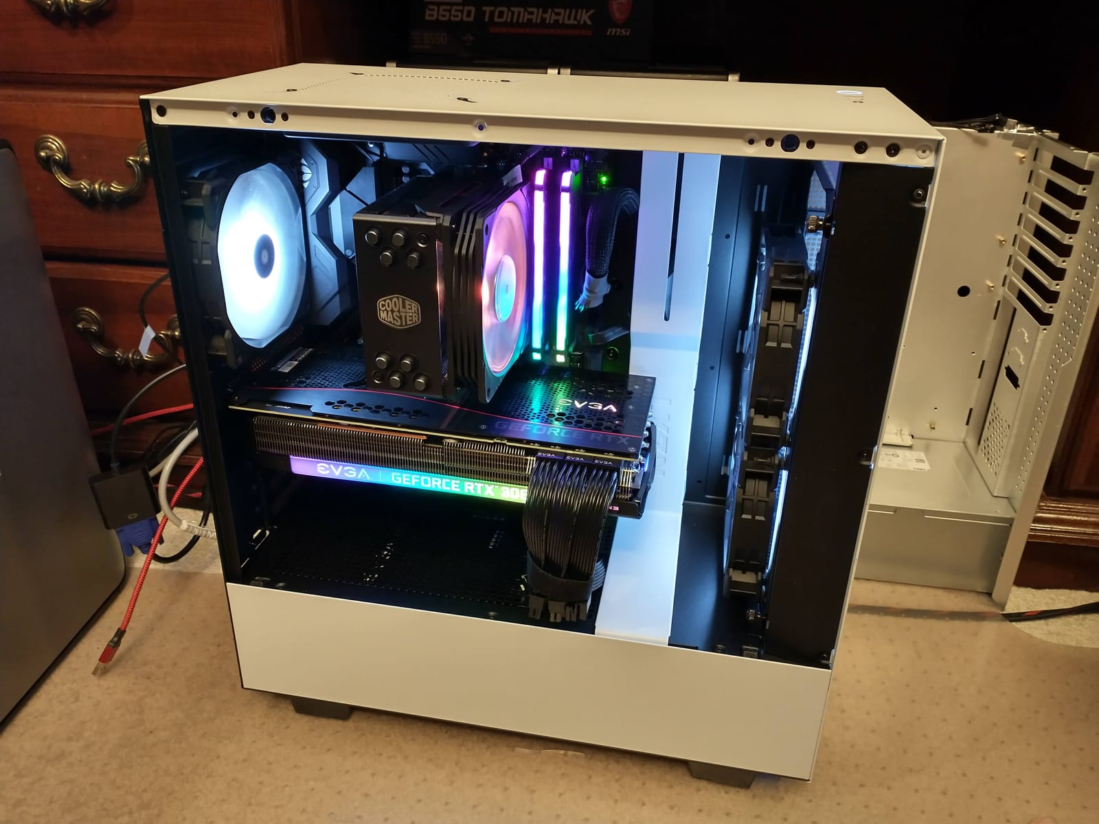 A custom desktop PC built and cable-managed on the bench at Moore Computer Services